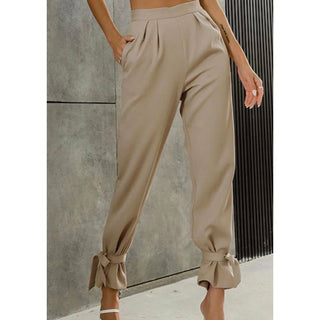 high waisted tan trousers with an ankle tie