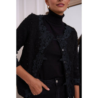     Short tweed jacket with ornate lace on the collar and two front pockets, front buttons, 3/4 sleeves