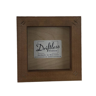 Wooden picture frame with 'Driftless Studios' label on a white background