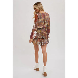 Scarf Print Romper is a stylish and playful piece that puts a unique spin on contemporary fashion. A lush scarf print pattern adds visual interest, while bubble sleeves and a ruffled hem create a unique impression. 
