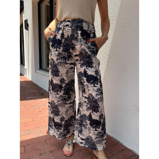 100% linen fabric handmade in Italy. Featuring a subtle, high-fashion-inspired safari print with lions, tigers, and trees