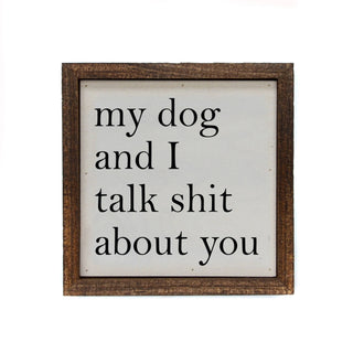 Framed sign with text 'my dog and I talk shit about you' on a white background