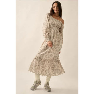 A floral print woven midi dress with the following features:
Square neckline.
Long sleeves with smocked cuffs.
Smocked bodice.
Thigh length lining.
Calf length.
Fit and flare