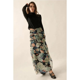 A floral print woven maxi skirt with the following features:
Semi-sheer fabric.
Smocked yoke waist.
Tiered ruffle skirt with trim.
Lined.
Ankle length.
Relaxed fit.