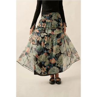 A floral print woven maxi skirt with the following features:
Semi-sheer fabric.
Smocked yoke waist.
Tiered ruffle skirt with trim.
Lined.
Ankle length.
Relaxed fit.