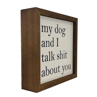 Wooden box sign with text 'my dog and I talk shit about you' on a white background