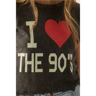 A mineral washed graphic t-shirt with the following features:
Vintage-style "I Love The 90's" text print with heart graphics.
Round neckline.
Short sleeves.
Lettuce-edge cuffs and hem.
Cropped length.
Relaxed fit.
