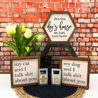 Set of humorous framed signs with a brick wall background