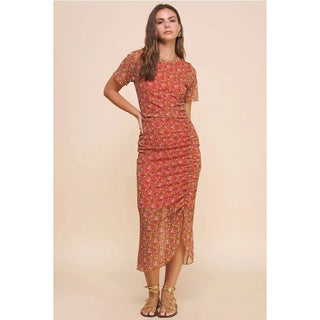 rust colored floral flirty ruched midi dress with mesh