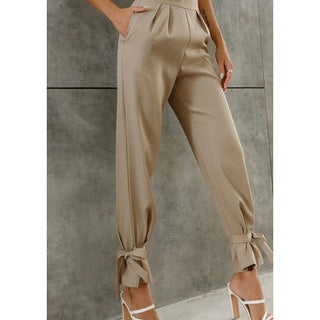 high waisted tan trousers with an ankle tie